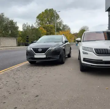 Parked cars narrowing the route, making it difficult for wheelchair users to pass safely