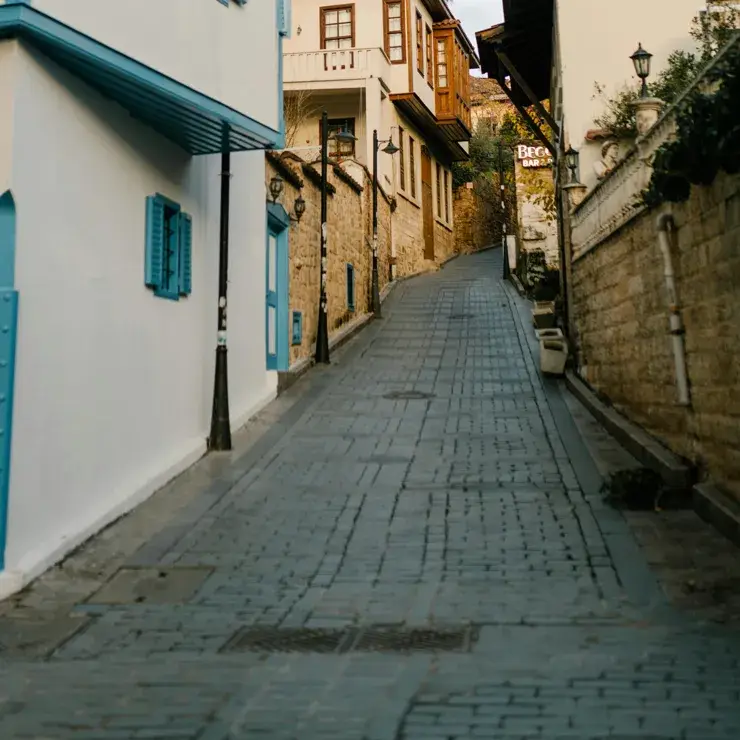 Steep uphill street that is difficult for wheelchair users and others with mobility needs to navigate