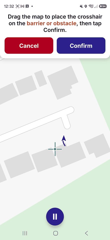 Placing a barrier: drag the map so the crosshair sits on the barrier, then tap Confirm