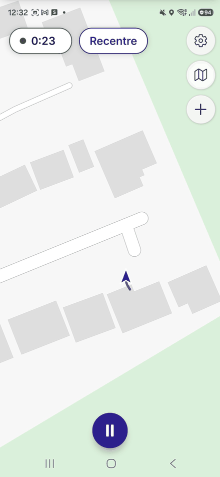 Recording in progress: the live map with a timer pill, a Recentre button, map controls and a round pause button